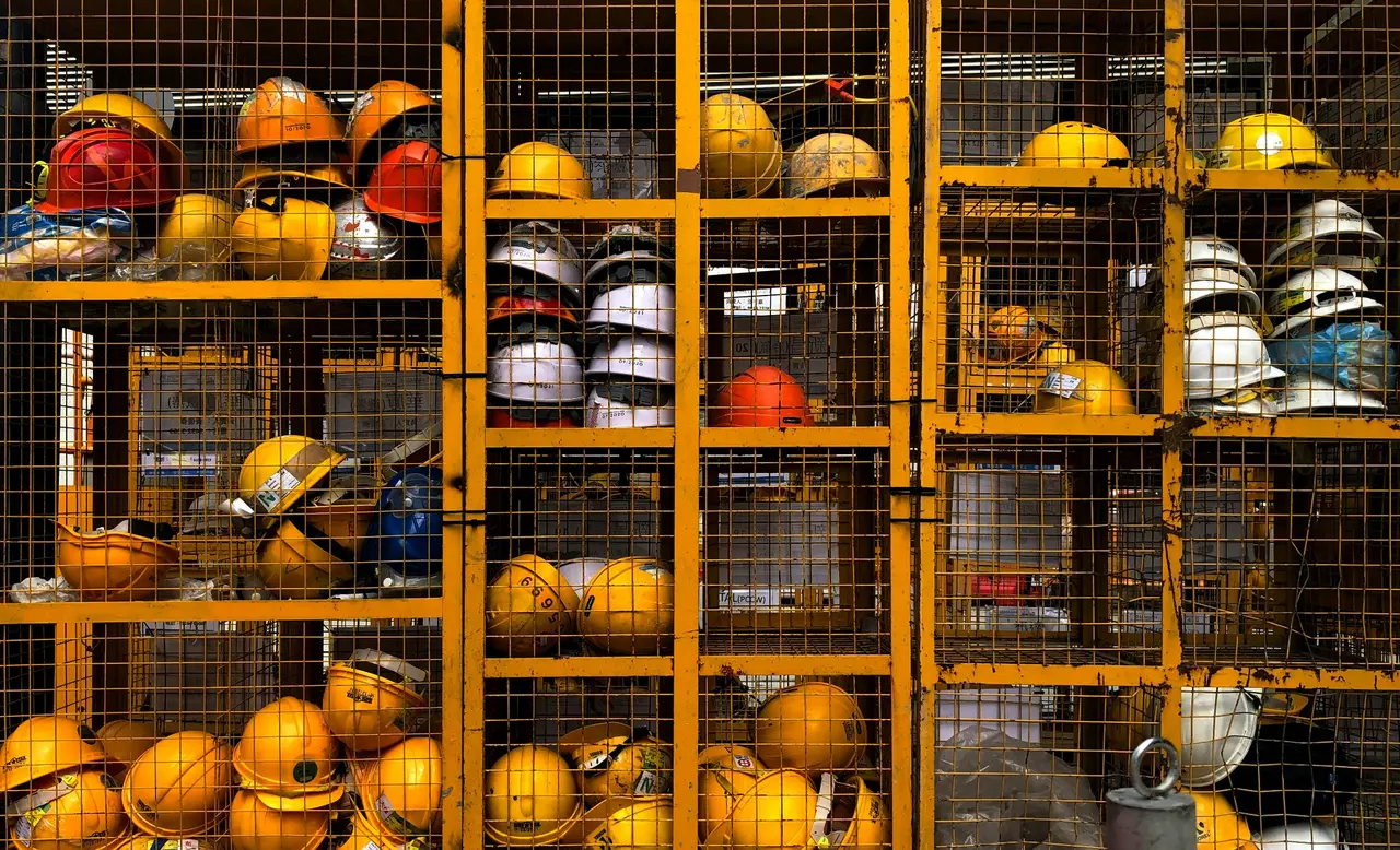 Safety helmets stored in equipment cages