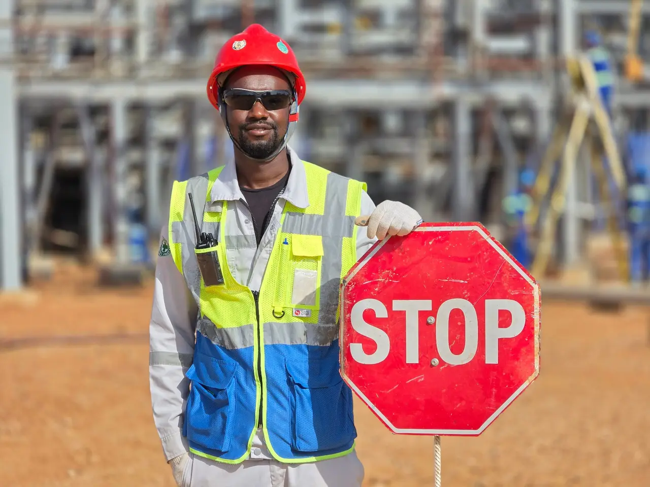 Safety worker holding a stop sign