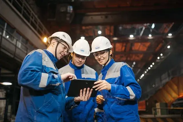 Industrial team reviewing information on a tablet